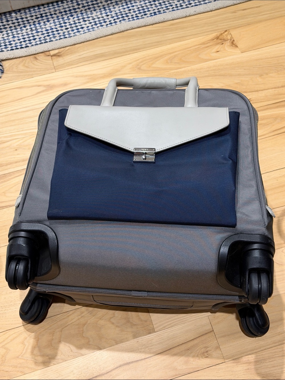 Tumi Navy and Light Gray Travel Carry On Roller Bag - Sleek Front Pouch